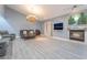 Relaxing living room with fireplace, comfortable seating and a large TV at 3829 Delaware Ln, Las Vegas, NV 89169