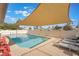 Inviting swimming pool with shade and lounge chairs at 3829 Delaware Ln, Las Vegas, NV 89169