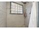 Updated shower with glass block window and new tile at 3829 Delaware Ln, Las Vegas, NV 89169