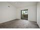 Bedroom featuring neutral carpet and a sliding glass door to the outside at 45 Maleena Mesa St # 223, Henderson, NV 89074
