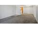 Carpeted living room leading to dining area, with kitchen visible beyond partial wall at 45 Maleena Mesa St # 223, Henderson, NV 89074