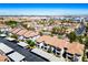 Aerial view shows a well-planned neighborhood with trees, covered parking, and community landscaping at 45 Maleena Mesa St # 223, Henderson, NV 89074