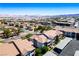 Aerial view showcases a neighborhood with well-maintained roofs and mountain views beyond at 45 Maleena Mesa St # 223, Henderson, NV 89074