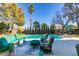 Relaxing poolside patio furniture and a sparkling pool at 4702 Blue Mesa Way, Las Vegas, NV 89129