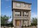Three-story home with stone accents and balcony at 4748 Parkarbor Ave, Las Vegas, NV 89141