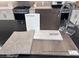 Kitchen features quartz countertops and luxury vinyl plank flooring at 4748 Parkarbor Ave, Las Vegas, NV 89141