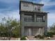 Modern two-story home with dark gray exterior and balcony at 4764 Parkarbor Ave, Las Vegas, NV 89141