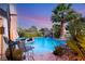 Inviting pool with waterfall feature and lounge chairs at 4920 Rancho Bernardo Way, Las Vegas, NV 89130