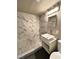 Modern bathroom with white vanity and pebble floor at 501 S Maryland Pkwy # B14, Las Vegas, NV 89101