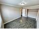 Bedroom with gray tile floors and spacious closet at 501 S Maryland Pkwy # B14, Las Vegas, NV 89101