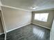 Bedroom with gray tile floors and large window at 501 S Maryland Pkwy # B14, Las Vegas, NV 89101