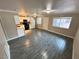 Open living room and kitchen with gray tile floors at 501 S Maryland Pkwy # B14, Las Vegas, NV 89101