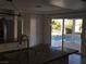 Kitchen with granite countertop, stainless steel appliances, and pool view at 502 Pale Pueblo Ct, Las Vegas, NV 89183