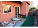 Small backyard with patio furniture and artificial turf at 5402 Cross Meadows Ln, Las Vegas, NV 89122