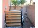 Small backyard with AC unit, planters, and fire hydrant at 5402 Cross Meadows Ln, Las Vegas, NV 89122