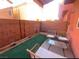Cozy patio with artificial turf and seating at 5402 Cross Meadows Ln, Las Vegas, NV 89122