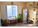 Bright bedroom with large window, plant, and full-length mirror at 5402 Cross Meadows Ln, Las Vegas, NV 89122