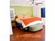 Spacious bedroom with king-size bed, wood floors, and ample natural light at 5402 Cross Meadows Ln, Las Vegas, NV 89122