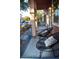 Inviting front porch with patio furniture and decorative planters at 5402 Cross Meadows Ln, Las Vegas, NV 89122