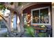 Inviting front porch with colorful flowers and seating at 5402 Cross Meadows Ln, Las Vegas, NV 89122