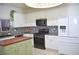 Modern kitchen with white cabinets and wood countertops at 5402 Cross Meadows Ln, Las Vegas, NV 89122