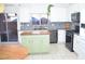 Modern kitchen with island and stainless steel appliances at 5402 Cross Meadows Ln, Las Vegas, NV 89122
