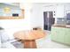Kitchen nook with round wood table and built-in bench at 5402 Cross Meadows Ln, Las Vegas, NV 89122