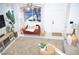 Bright living room with comfy seating, large windows, and a cozy atmosphere at 5402 Cross Meadows Ln, Las Vegas, NV 89122