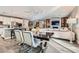 Open concept dining area with a modern table and chairs next to the kitchen at 5627 Felicity Cir, Las Vegas, NV 89139