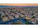 Aerial view of a residential neighborhood with houses and a park at 6005 Bristol Crest Ln, Las Vegas, NV 89139