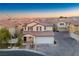 Two-story house with attached garage and neighborhood view at 6005 Bristol Crest Ln, Las Vegas, NV 89139
