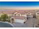 Two-story house with attached garage and neighborhood view at 6005 Bristol Crest Ln, Las Vegas, NV 89139