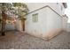 Small backyard with gravel landscaping and access from a sliding glass door at 6005 Bristol Crest Ln, Las Vegas, NV 89139