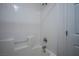 Clean bathroom with a shower/tub combo and tile surround at 6005 Bristol Crest Ln, Las Vegas, NV 89139