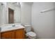 Clean bathroom with wood vanity and toilet at 6005 Bristol Crest Ln, Las Vegas, NV 89139