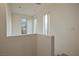 Bright landing area with three windows looking out to trees at 6005 Bristol Crest Ln, Las Vegas, NV 89139
