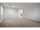 Spacious living room with neutral carpeting and staircase at 6005 Bristol Crest Ln, Las Vegas, NV 89139