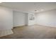 Bright living room featuring neutral walls and carpet at 6005 Bristol Crest Ln, Las Vegas, NV 89139