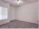 Well-lit bedroom featuring ceiling fan and carpet flooring at 6160 Rumrill St # 122, Las Vegas, NV 89113