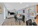 Bright dining area with glass table and seating for six, adjacent to kitchen at 6554 Macdoogle St, Las Vegas, NV 89166