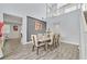 Spacious dining room with wood floors and a modern table at 6554 Macdoogle St, Las Vegas, NV 89166