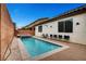 Inviting rectangular pool with a spa and plenty of seating at 8811 Pauley Hills St, Las Vegas, NV 89131