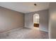 Bright bedroom with grey walls and carpet, featuring an ensuite bathroom at 9000 Las Vegas Blvd # 2134, Las Vegas, NV 89123