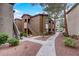 Well-maintained condo building with a walkway and landscaping at 9000 Las Vegas Blvd # 2134, Las Vegas, NV 89123