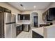 Kitchen with stainless steel appliances and dark cabinets at 9000 Las Vegas Blvd # 2134, Las Vegas, NV 89123