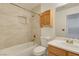 Bathroom with a shower/tub combo and wood vanity at 10082 Swimming Hole St, Las Vegas, NV 89183