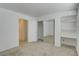 Bedroom with mirrored closet doors and built-in shelving at 10082 Swimming Hole St, Las Vegas, NV 89183