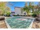 Private backyard basketball court with surrounding trees at 10150 Timber Willow Ave, Las Vegas, NV 89135