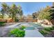 Private backyard basketball court with green and tan surface at 10150 Timber Willow Ave, Las Vegas, NV 89135