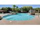 Resort-style community pool with a cascading waterfall at 10150 Timber Willow Ave, Las Vegas, NV 89135